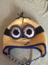 minion hat, despicable me minion hat, how to crochet, how to crochet a hat, how to crochet a beanie hat, beanie hat with earflaps, crochet beanie hat with earflaps, how to crochet a minion hat, how to crochet eyes, how to crochet a mouth, how to make hair with yarn, how to crochet a hat, childrens crochet hats, adult crochet hat, baby crochet hats, how to crochet hats for kids, beginner crochet patterns, how to crochet hat for beginners, youtube crochet tutorial, redheart yarn, redheart super saver yarn, yellow yarn, black yarn, blue yarn, grey yarn, brown yarn, white yarn, crochet in the round 